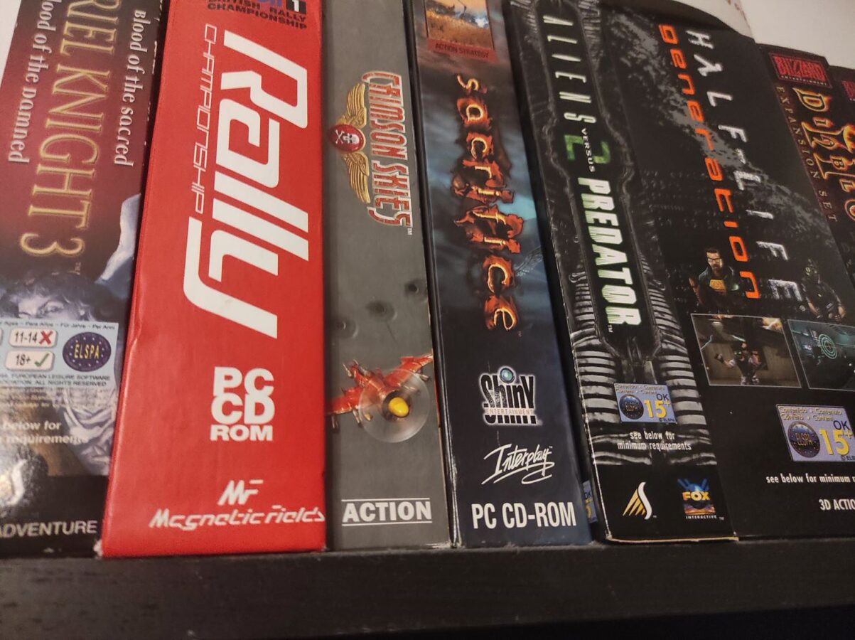 PC big box games stacked on shelf