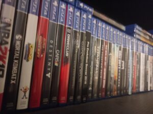 lots of ps4 games on a shelf