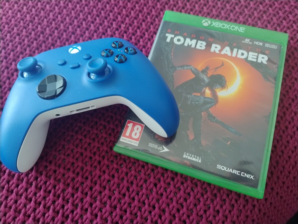 shadow of the tomb raider xbox one and a blue controller
